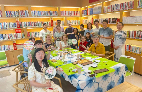 International volunteers bring Song Dynasty-style tea pastries to life, fostering community co-governance in Guangzhou's Nansha