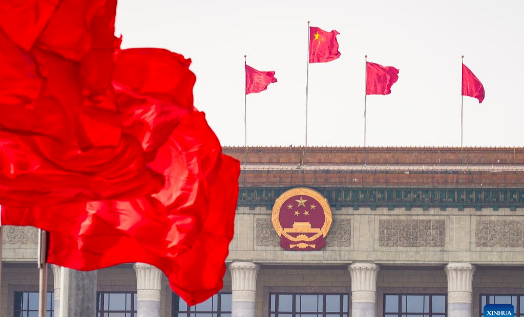 China's national legislature holds closing meeting of annual session